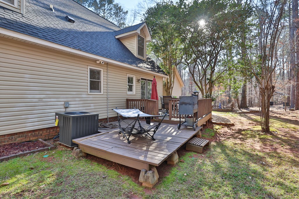1236 Martin Road Hamilton, GA 31811 - Photo 25 of 33 a view of a backyard with table and chairs and wooden fence