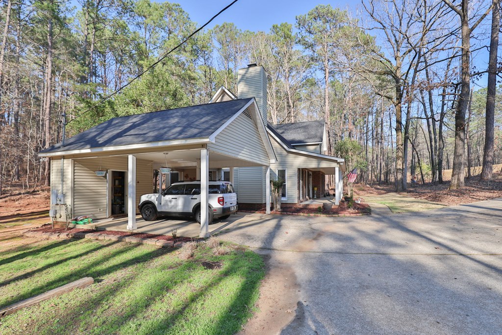 1236 Martin Road Hamilton, GA 31811 - Photo 3 of 33 a view of a house with backyard porch and sitting area