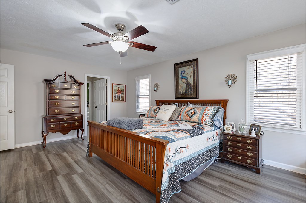 1236 Martin Road Hamilton, GA 31811 - Photo 10 of 33 a bed room with a bed and a chandelier