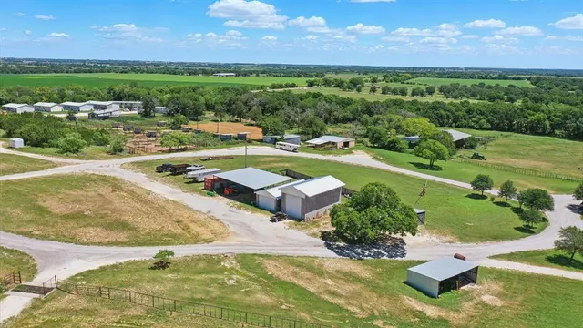 a view of a swimming pool with a yard