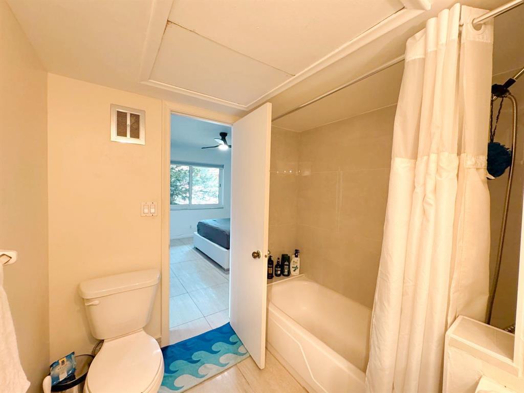136 Northeast 19th Court, Unit 216F Wilton Manors, FL 33305 - Photo 10 of 26 a bathroom with a sink and toilet