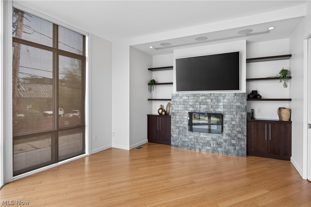 1840 Coltman Road Cleveland, OH 44106 - Photo 6 of 49 The Living Room with floating gas fireplace and automatic window blinds