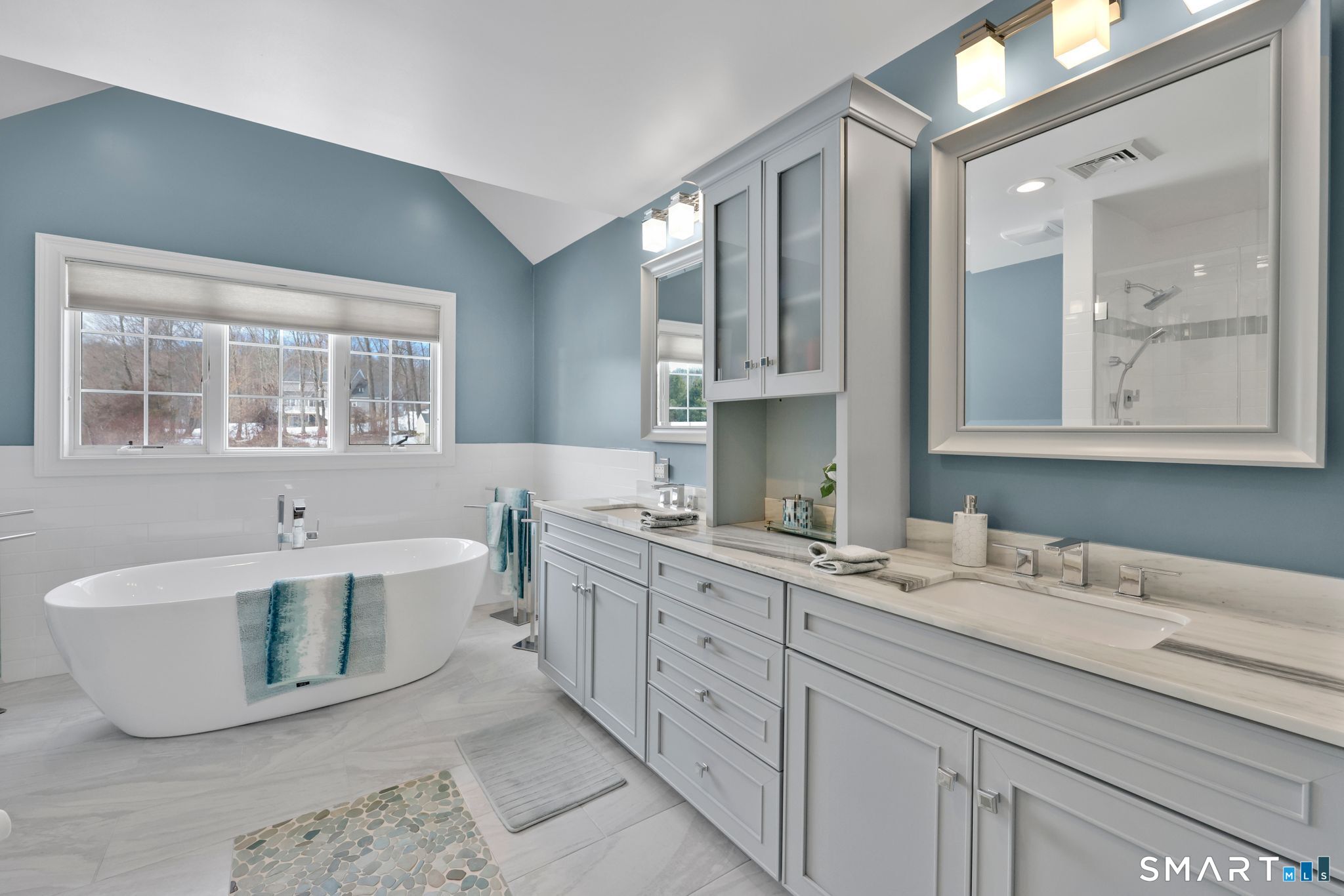 65 Trailside Drive Monroe, CT 06468 - Photo 22 of 39 a bathroom with a tub sink and mirror