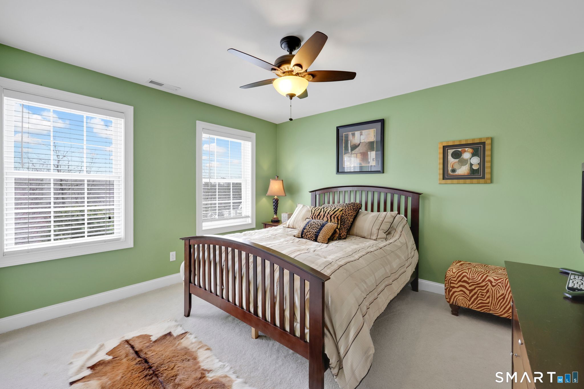 65 Trailside Drive Monroe, CT 06468 - Photo 24 of 39 a bedroom with a bed and a chandelier