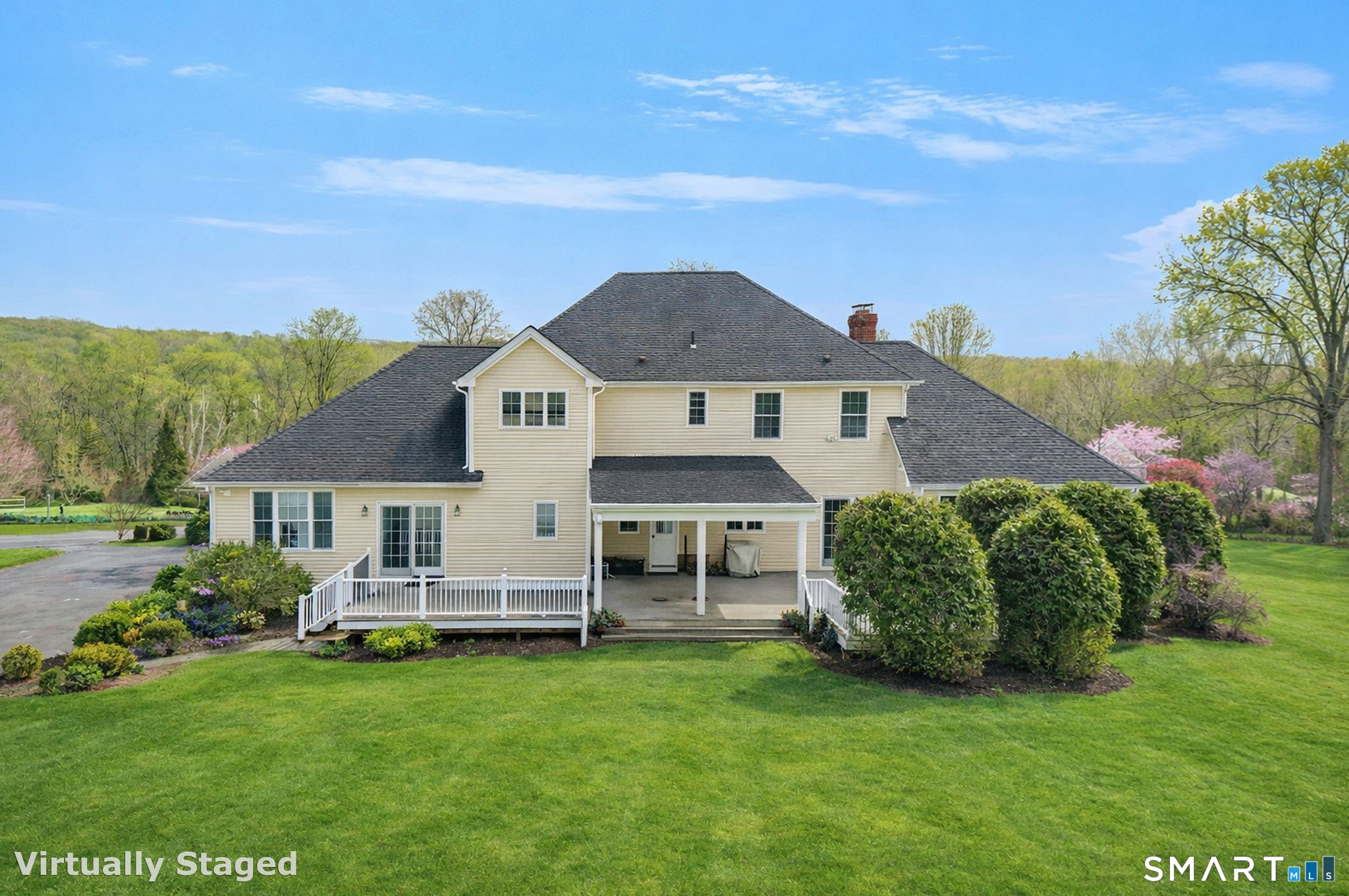 65 Trailside Drive Monroe, CT 06468 - Photo 3 of 39 a front view of a house with a garden