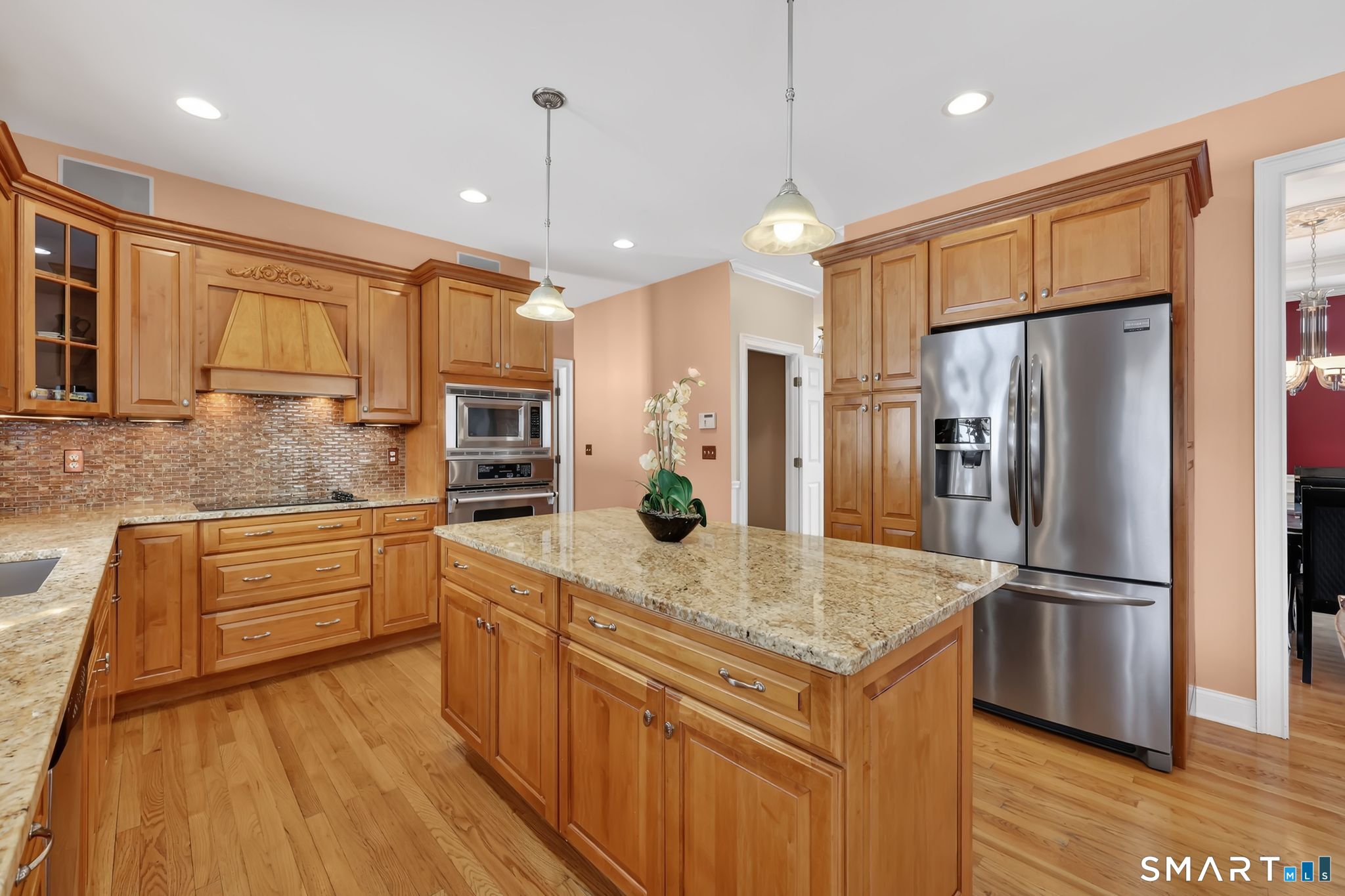 65 Trailside Drive Monroe, CT 06468 - Photo 6 of 39 a kitchen with a refrigerator sink and microwave