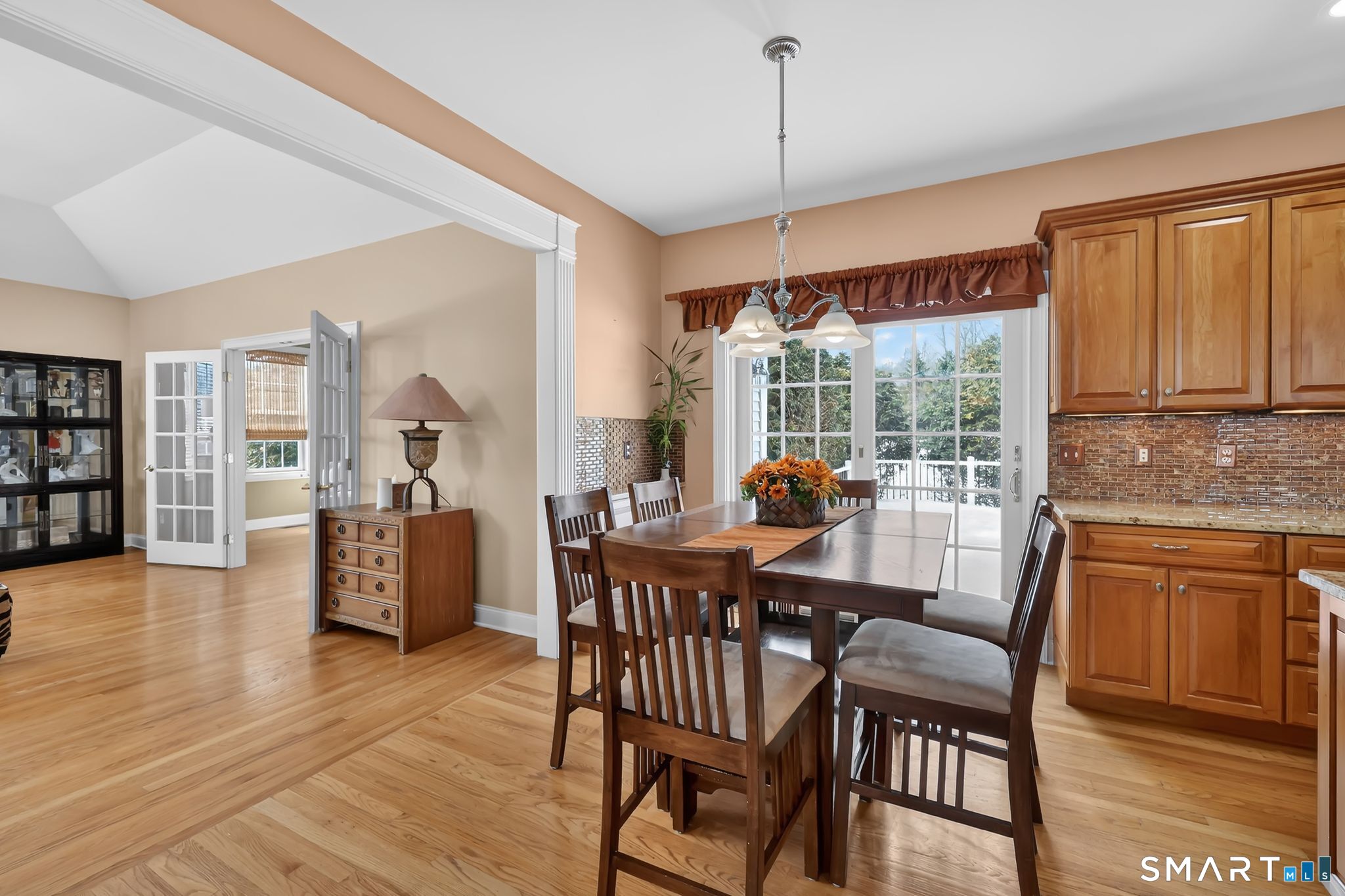 65 Trailside Drive Monroe, CT 06468 - Photo 8 of 39 a view of a dining room with furniture window and wooden floor