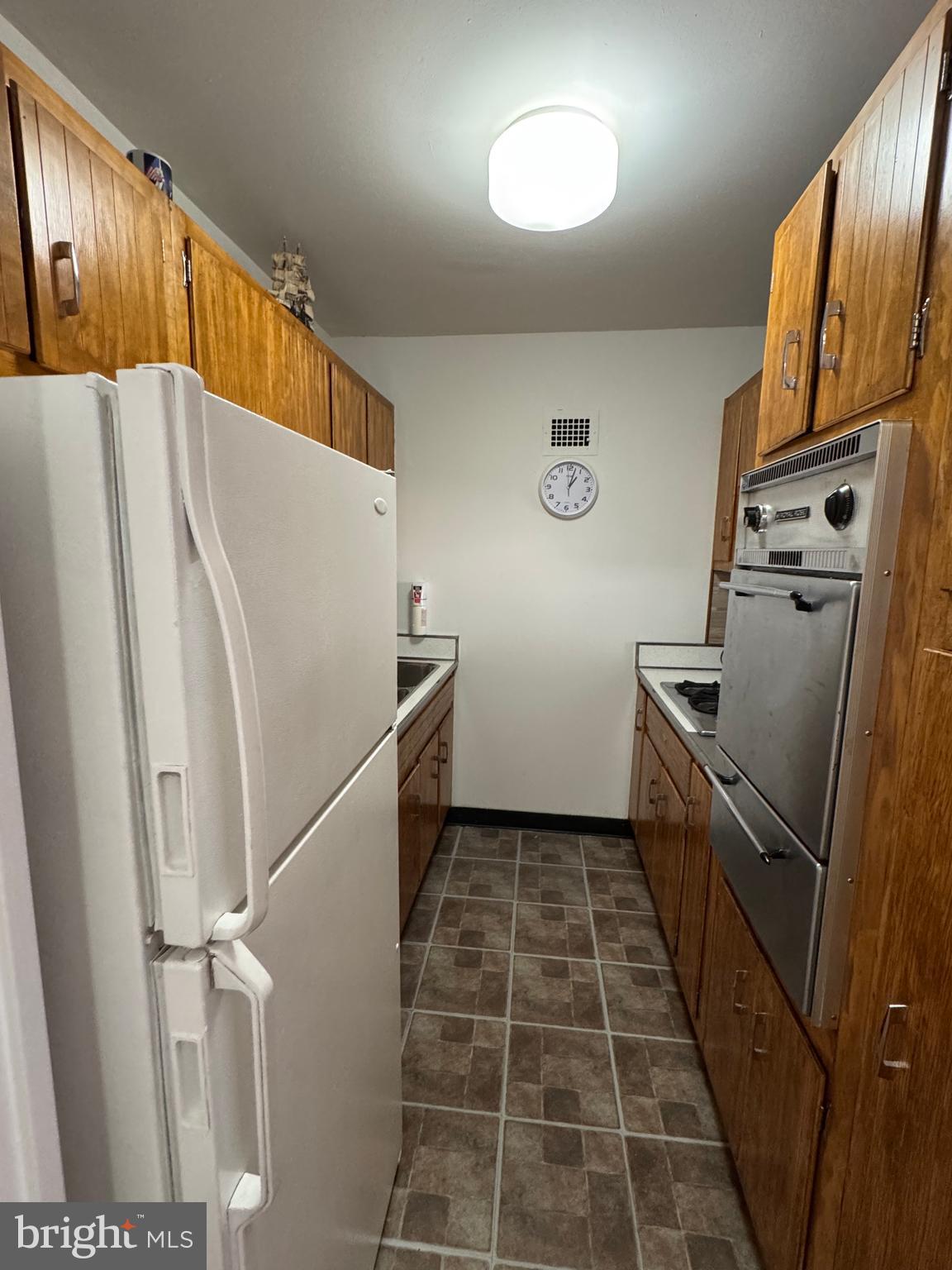 1517 Hill Road Reading, PA 19602 - Photo 3 of 12 a kitchen with a refrigerator and a sink