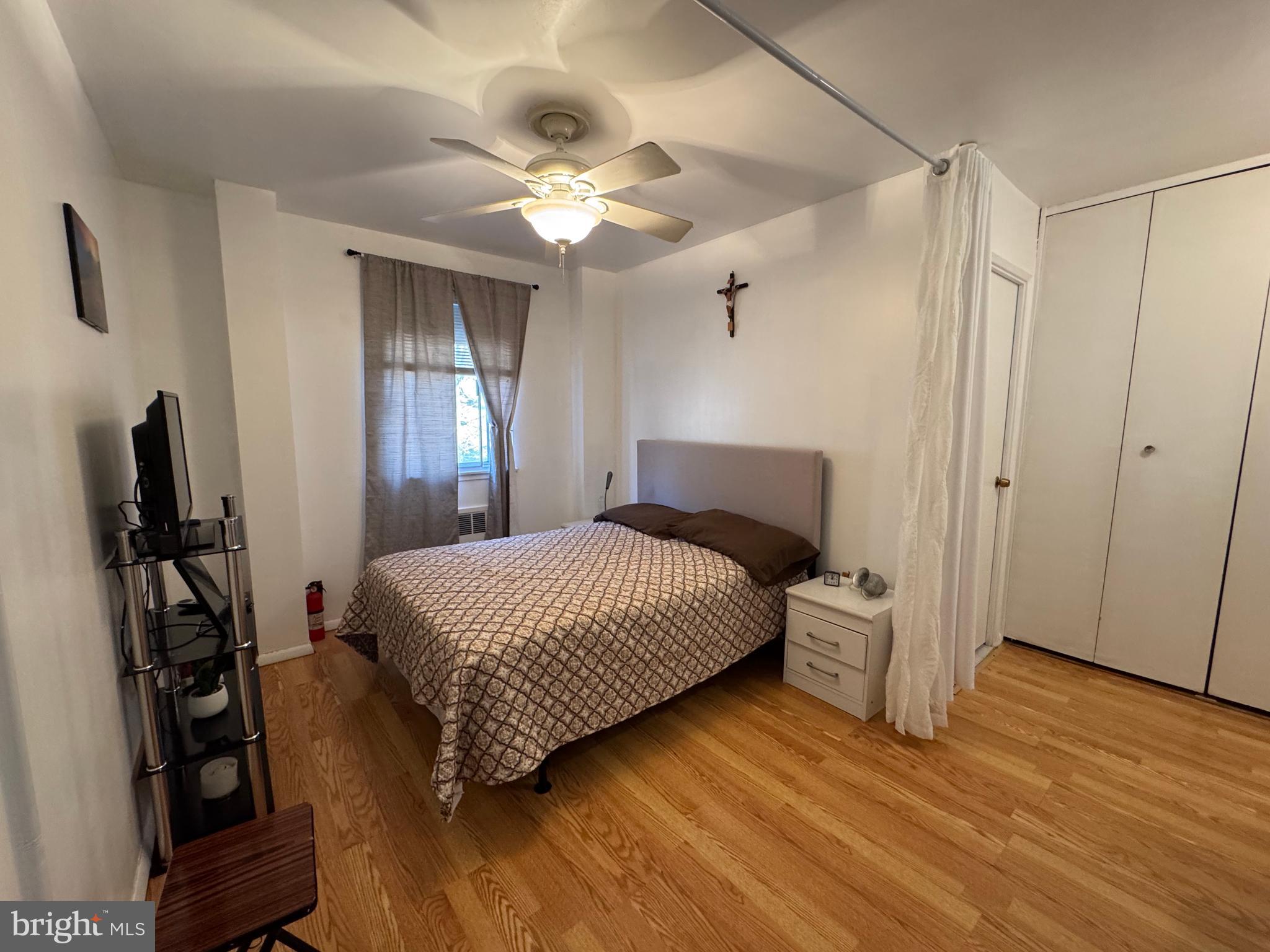 1517 Hill Road Reading, PA 19602 - Photo 8 of 12 a bedroom with a bed and a flat tv screen on dresser