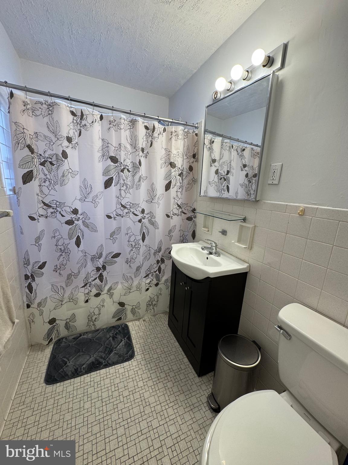 1517 Hill Road Reading, PA 19602 - Photo 10 of 12 a bathroom with a sink toilet and mirror