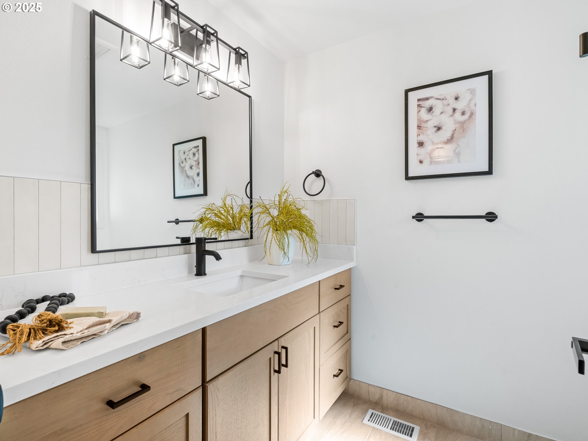 12942 Northeast Morris Street Portland, OR 97230 - Photo 16 of 28 a bathroom with a sink mirror and vanity