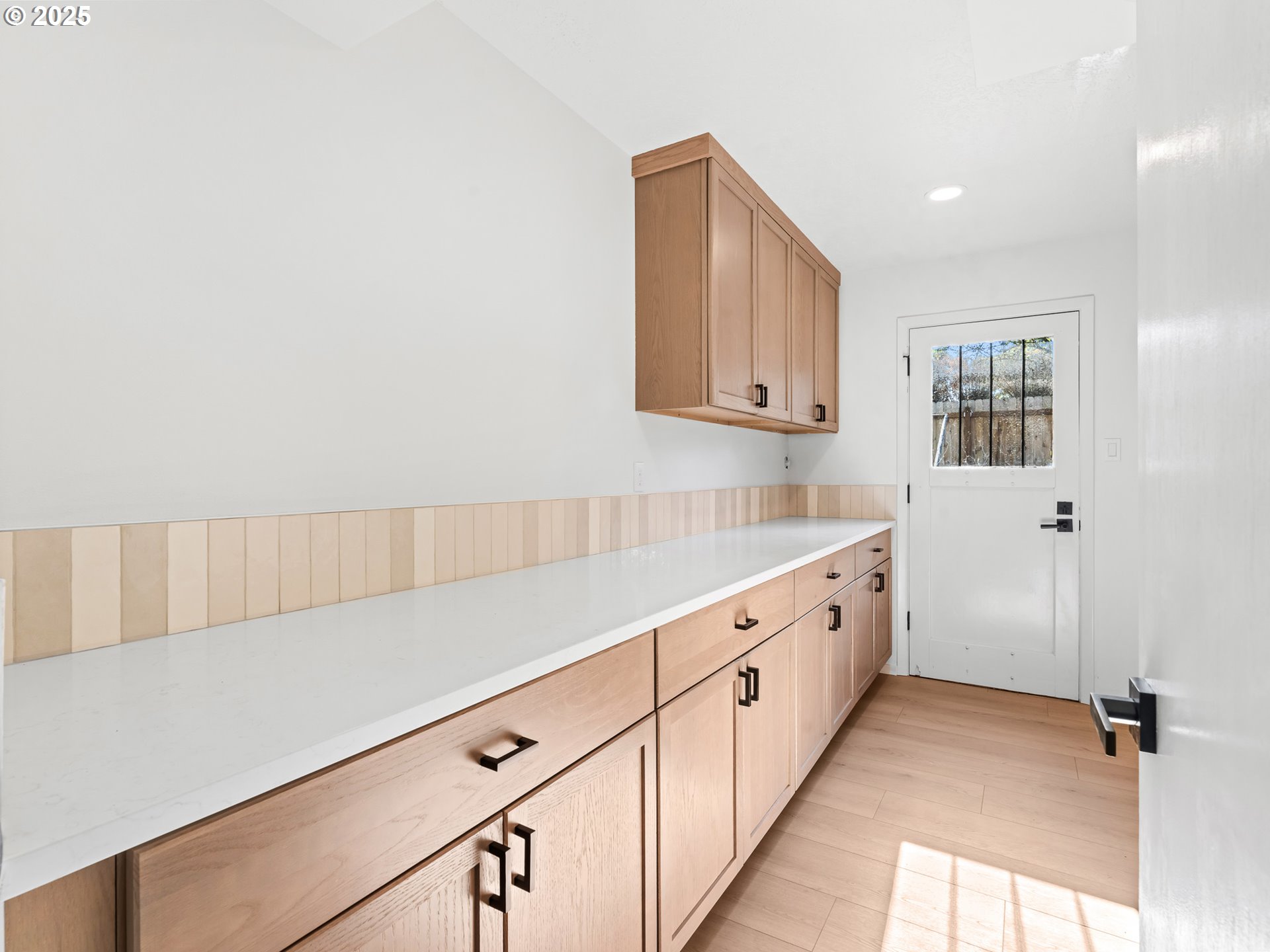 12942 Northeast Morris Street Portland, OR 97230 - Photo 20 of 28 a kitchen with granite countertop white cabinets and white appliances
