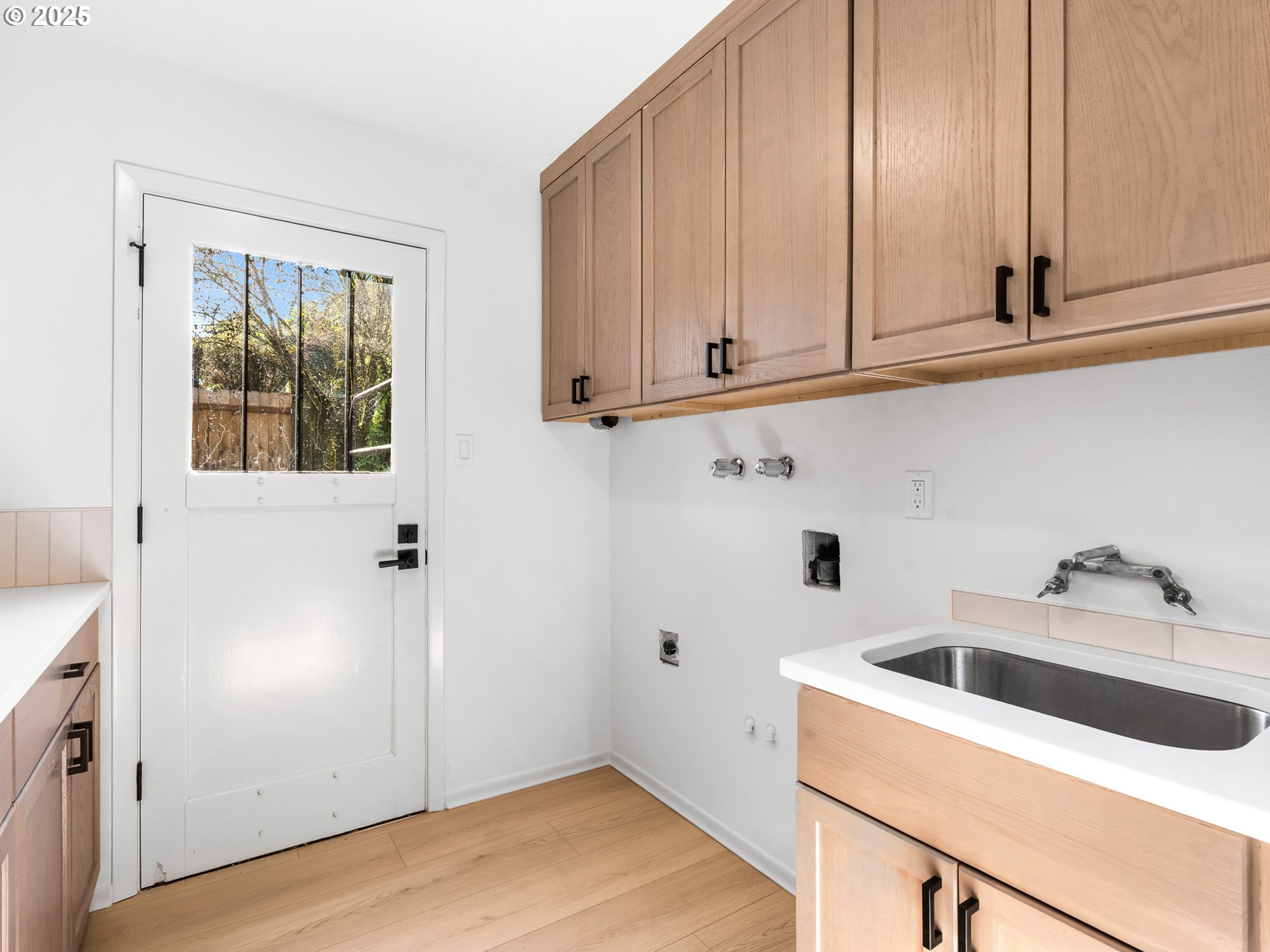 12942 Northeast Morris Street Portland, OR 97230 - Photo 21 of 28 a kitchen with a sink and cabinets