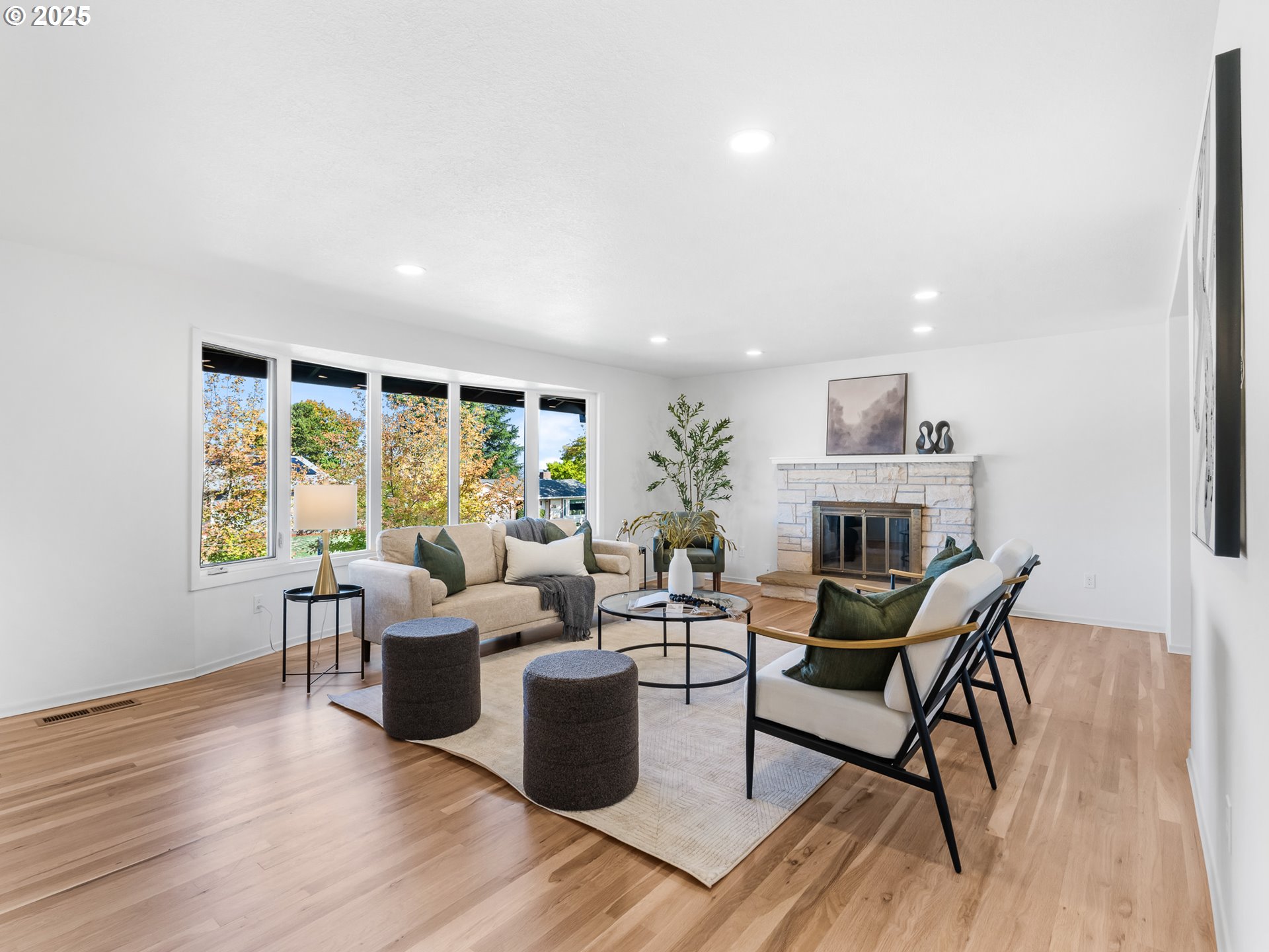 12942 Northeast Morris Street Portland, OR 97230 - Photo 4 of 28 a living room with fireplace furniture and a wooden floor