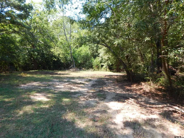 a view of a and covered mountains in a background