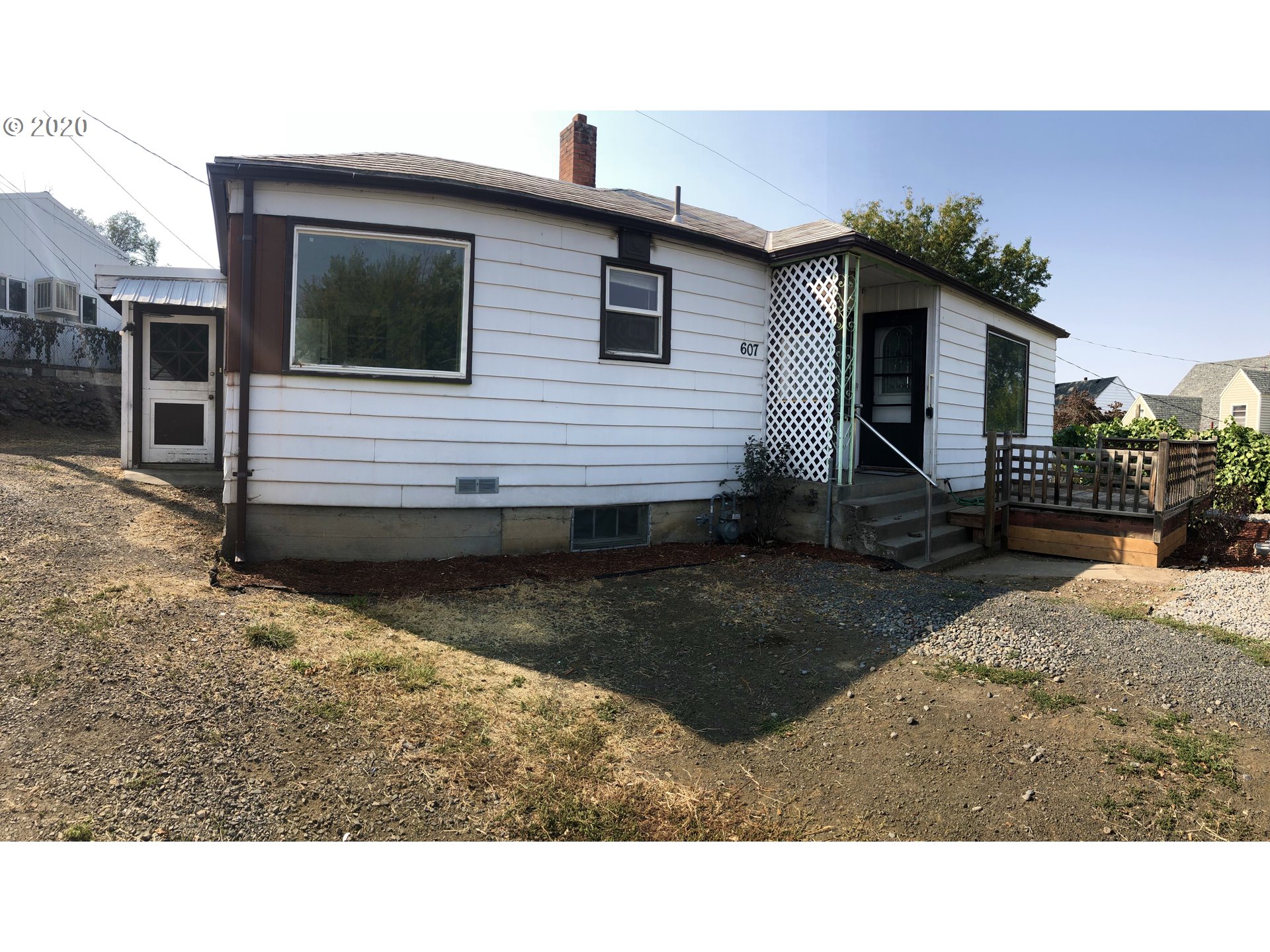 607 Southwest 10th Street Pendleton, OR 97801 - Photo 1 of 15 a view of a house with a backyard