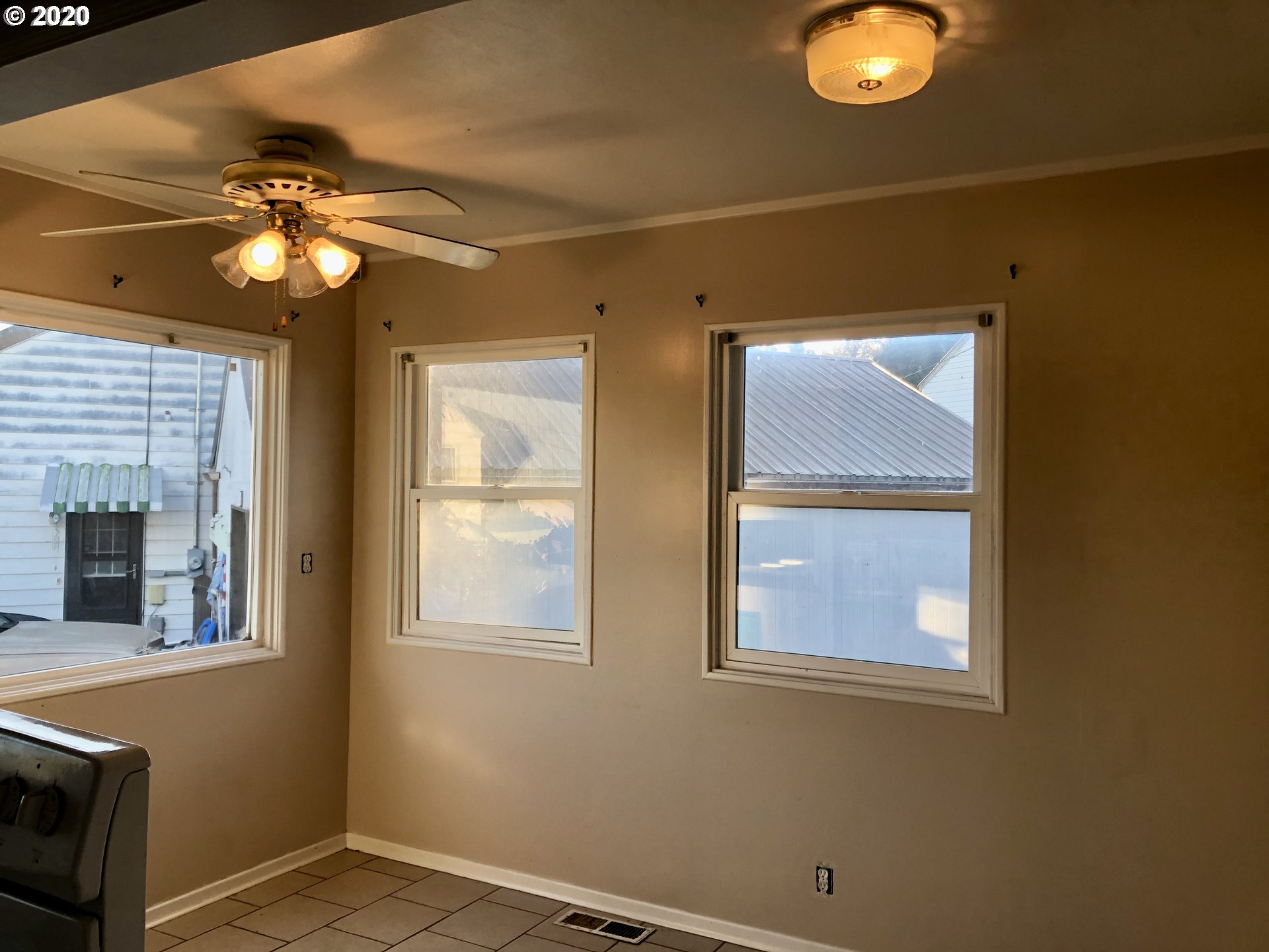 607 Southwest 10th Street Pendleton, OR 97801 - Photo 7 of 15 a view of a livingroom with a chandelier fan and a window