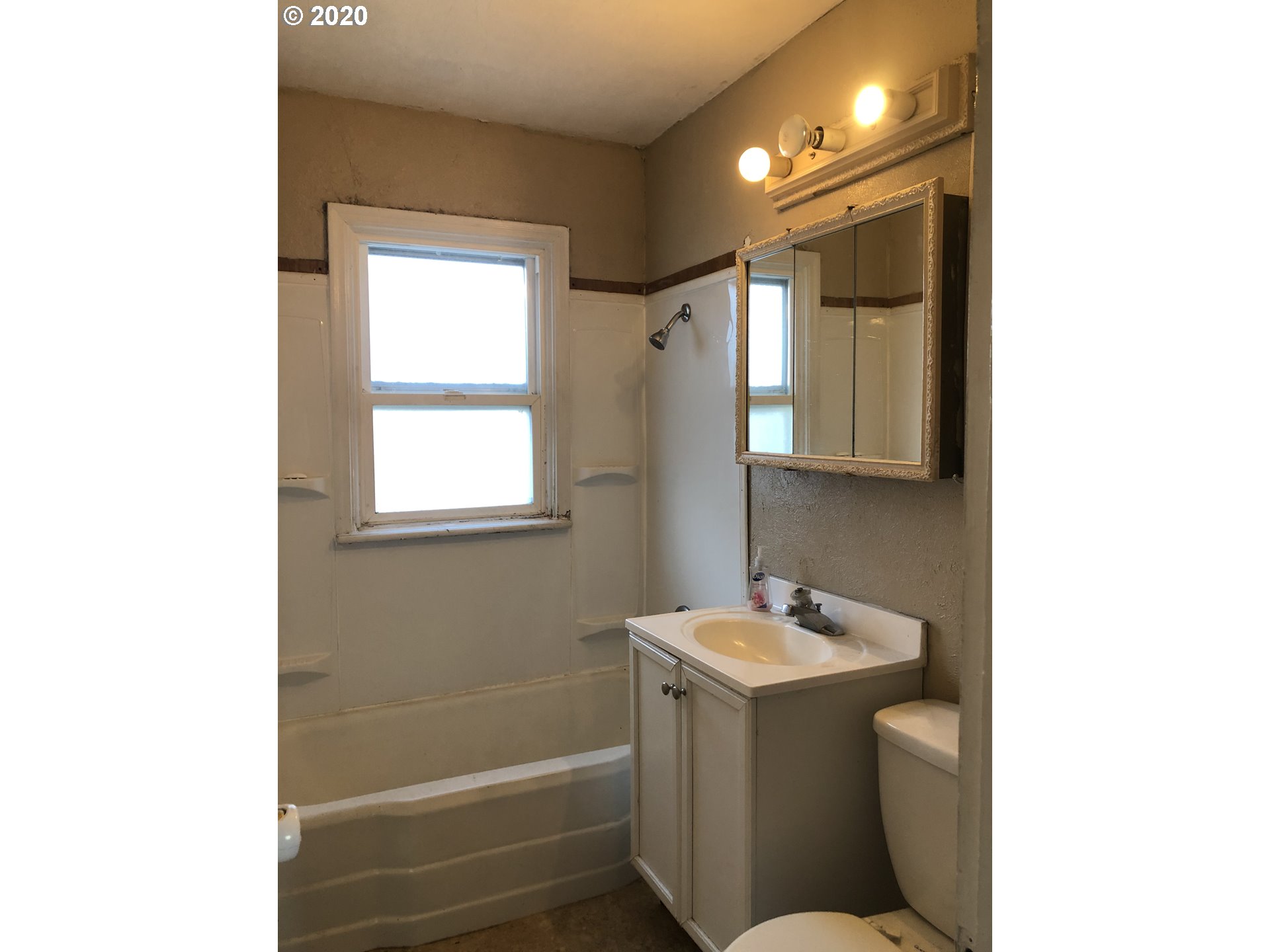 607 Southwest 10th Street Pendleton, OR 97801 - Photo 9 of 15 a bathroom with a sink and a mirror