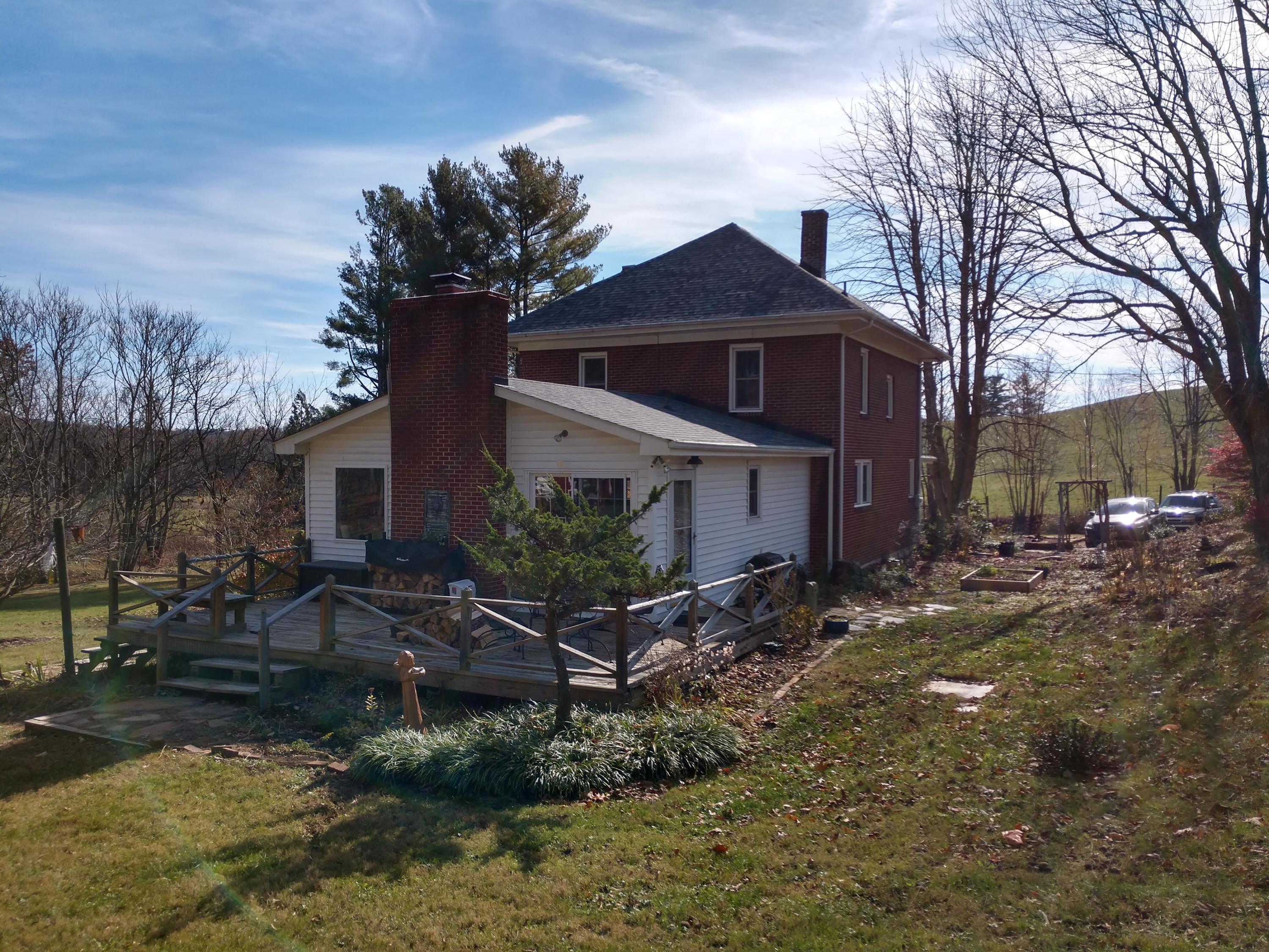 7909 Bear Ridge Road Southeast Copper Hill, VA 24079 - Photo 44 of 61 a front view of a house with a yard
