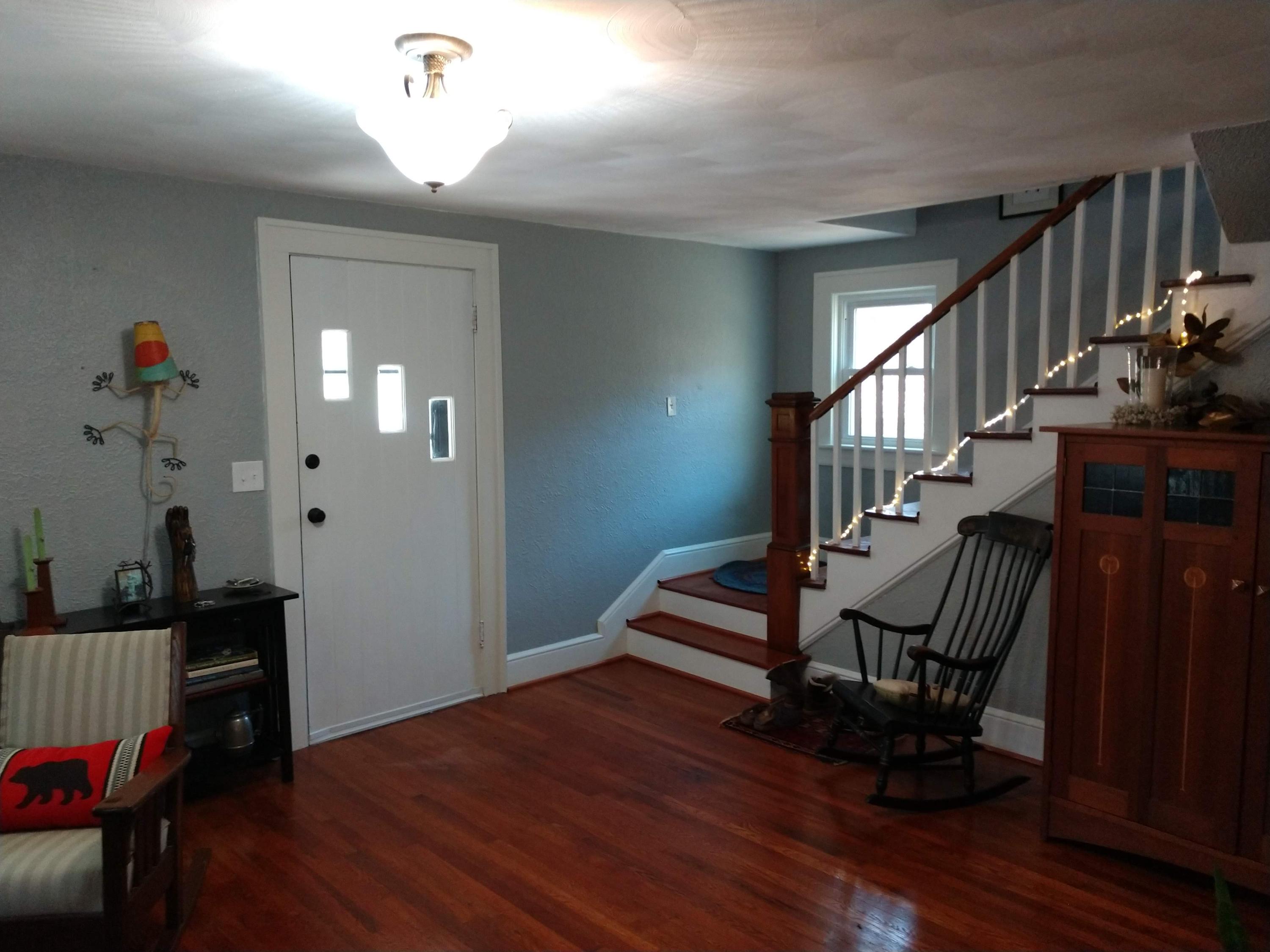 7909 Bear Ridge Road Southeast Copper Hill, VA 24079 - Photo 8 of 61 a view of entryway with wooden floor and stairs