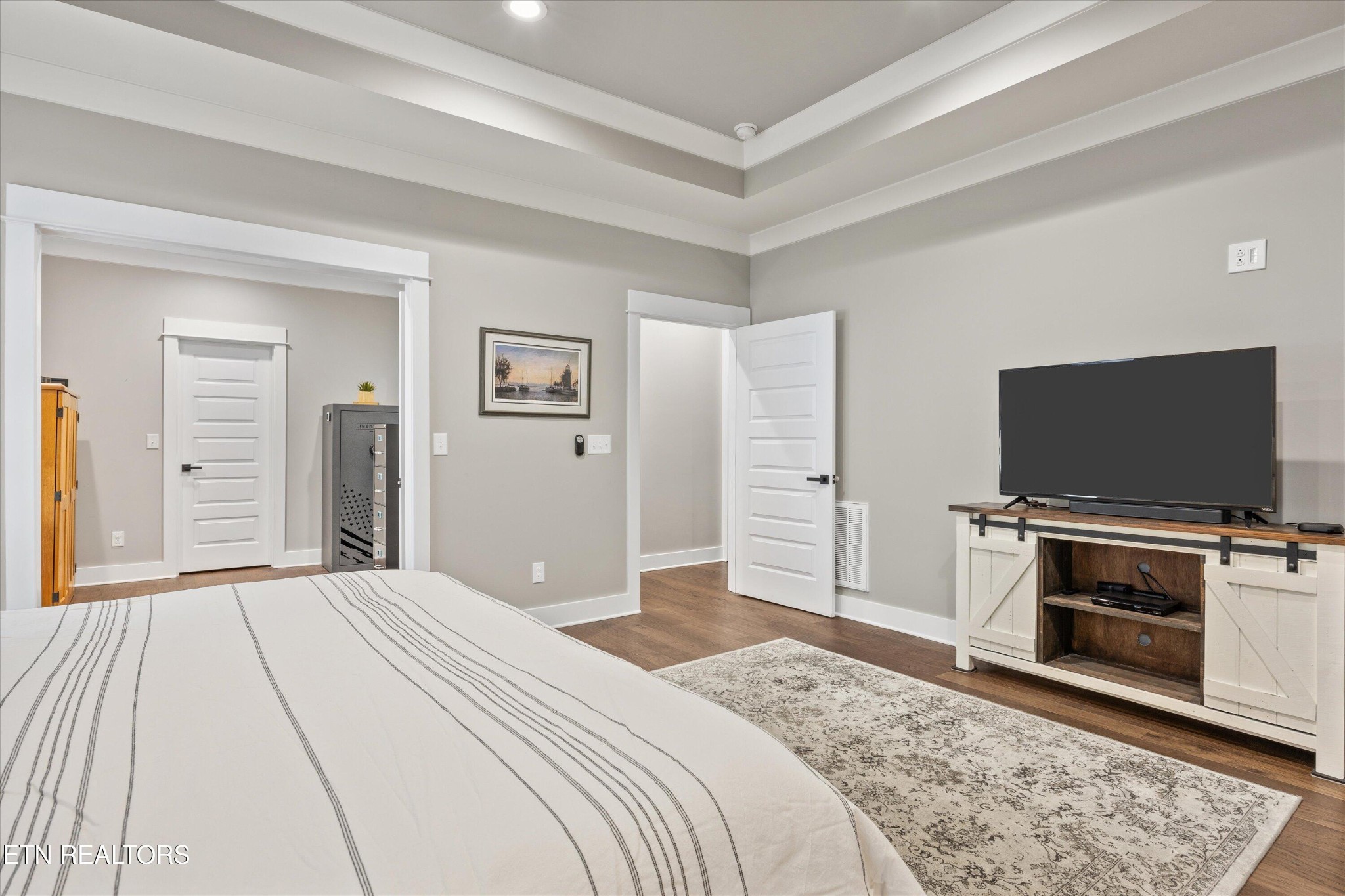 364 Mingo Way Loudon, TN 37774 - Photo 12 of 55 a bedroom with a bed and a flat screen tv