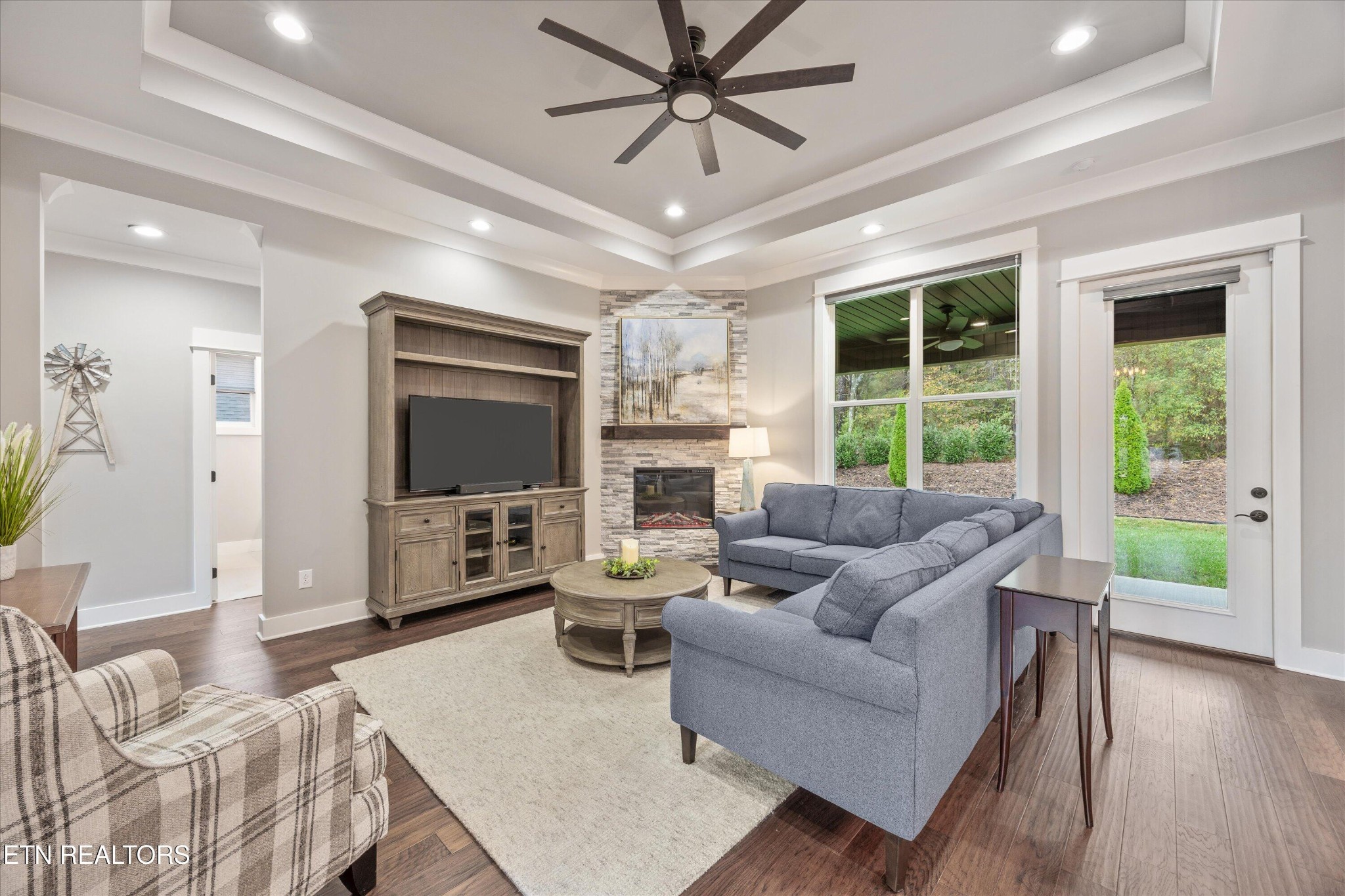 364 Mingo Way Loudon, TN 37774 - Photo 22 of 55 a living room with furniture a flat screen tv and a large window