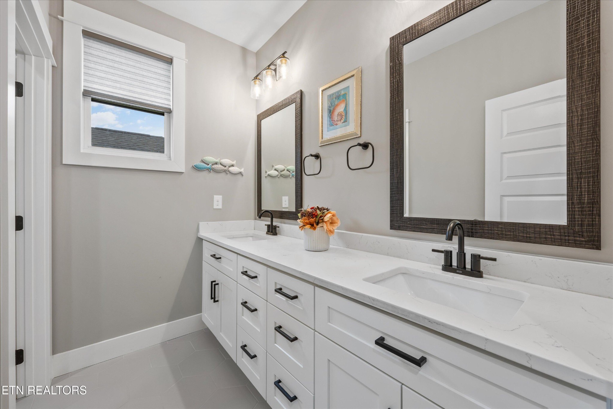 364 Mingo Way Loudon, TN 37774 - Photo 25 of 55 a bathroom with a double vanity sink and a mirror