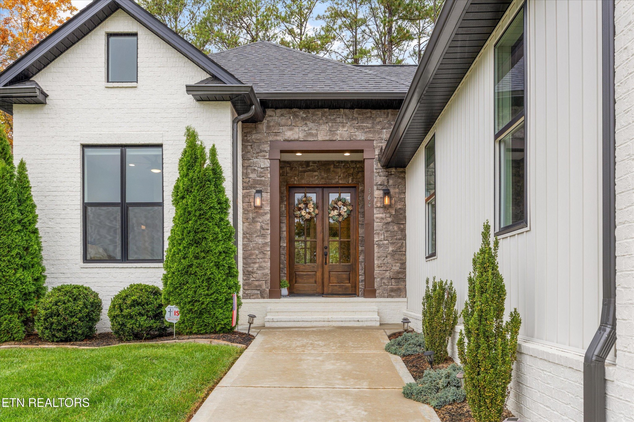 364 Mingo Way Loudon, TN 37774 - Photo 36 of 55 a view of a house with brick walls and a yard with plants