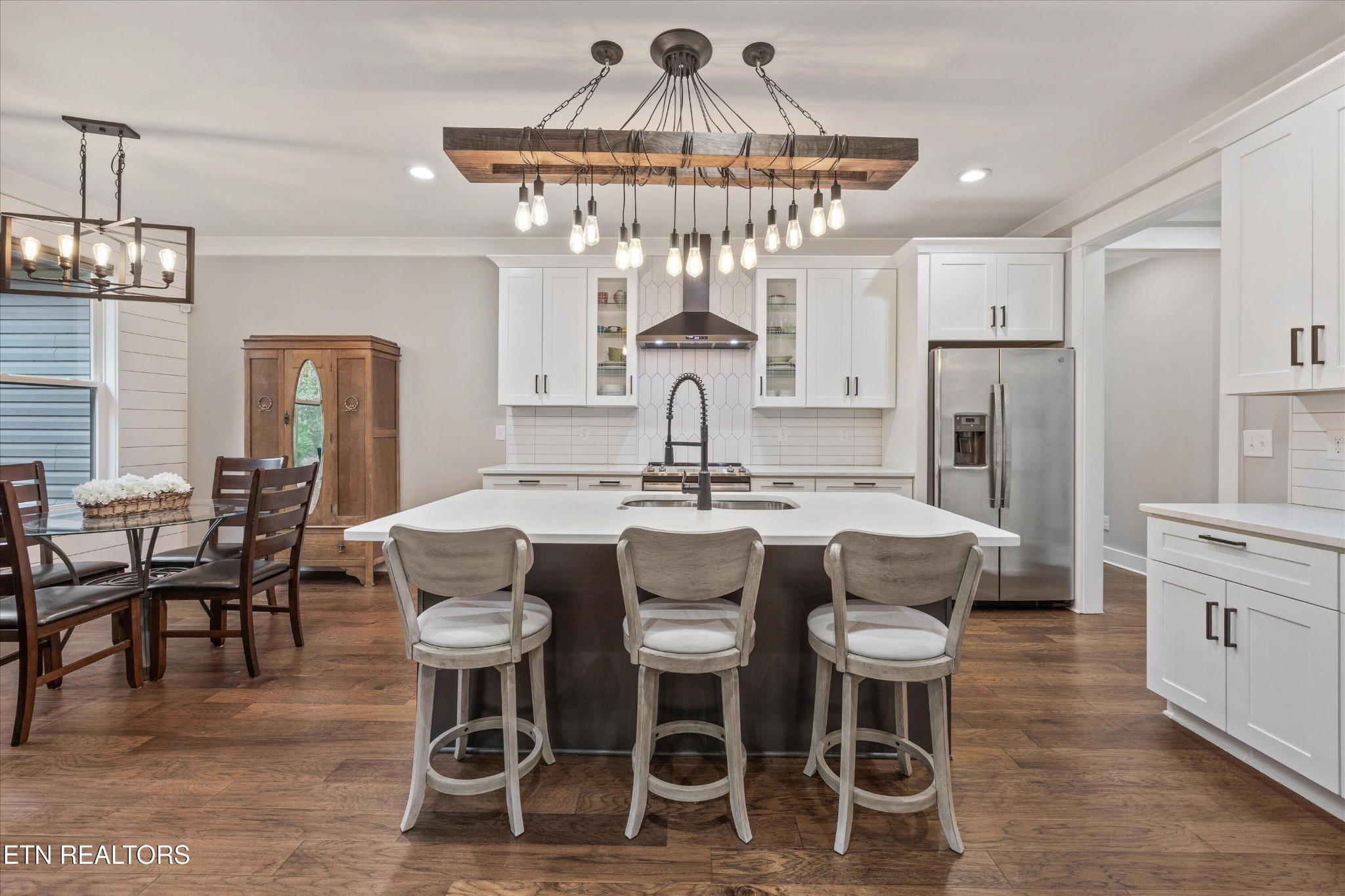 364 Mingo Way Loudon, TN 37774 - Photo 4 of 55 a view of a dining room with furniture a chandelier and wooden floor