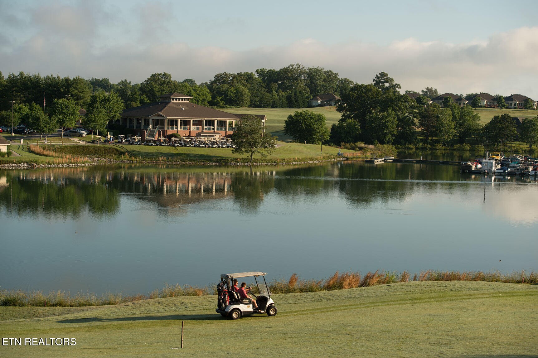 364 Mingo Way Loudon, TN 37774 - Photo 43 of 55 a view of a lake with houses in the back