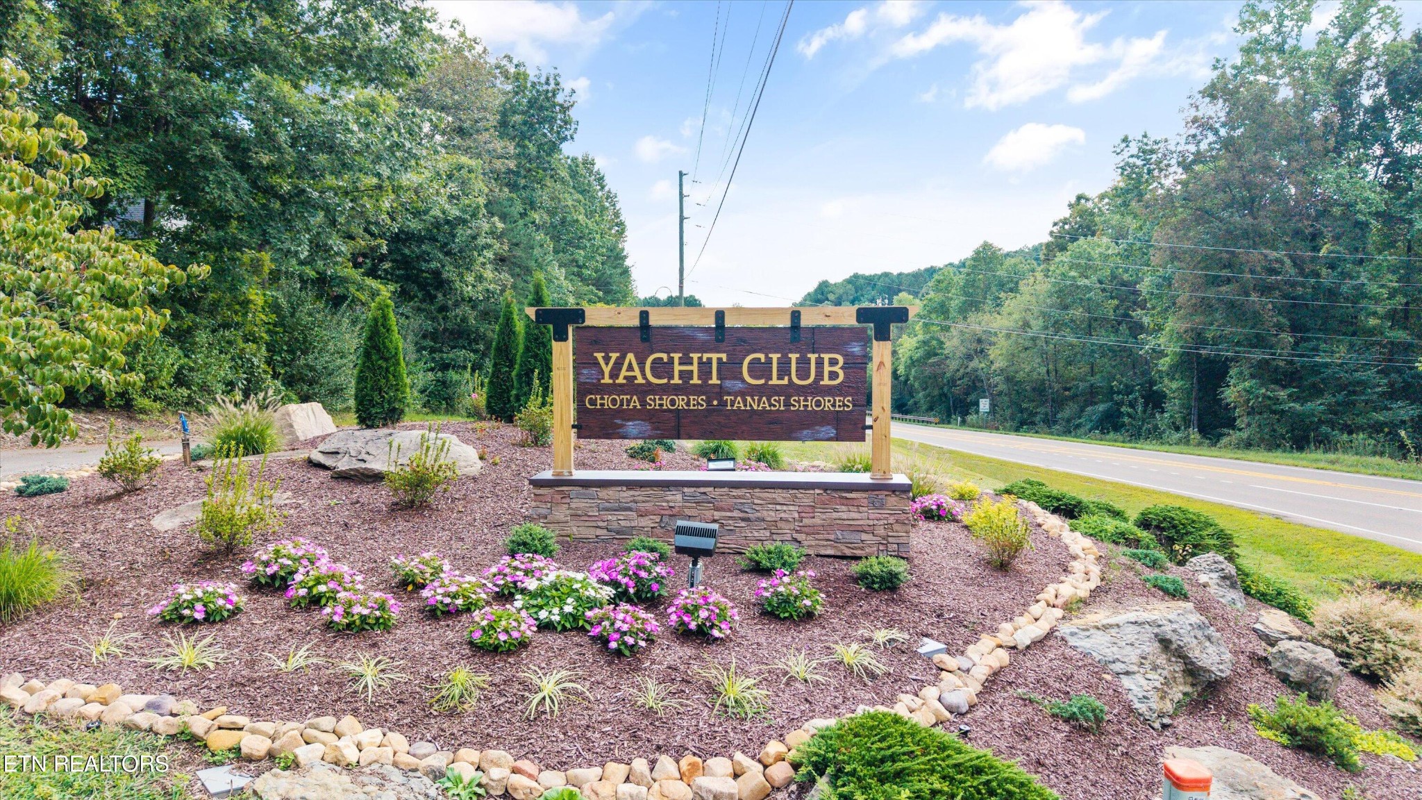364 Mingo Way Loudon, TN 37774 - Photo 45 of 55 a sign that is sitting in the middle of flowers