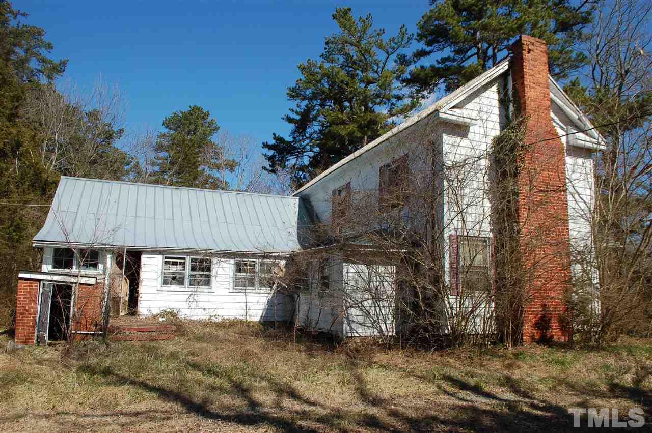 820 Billy Hicks Road Roxboro, NC 27574 - Photo 21 of 27 a view of a house with a yard and sitting area