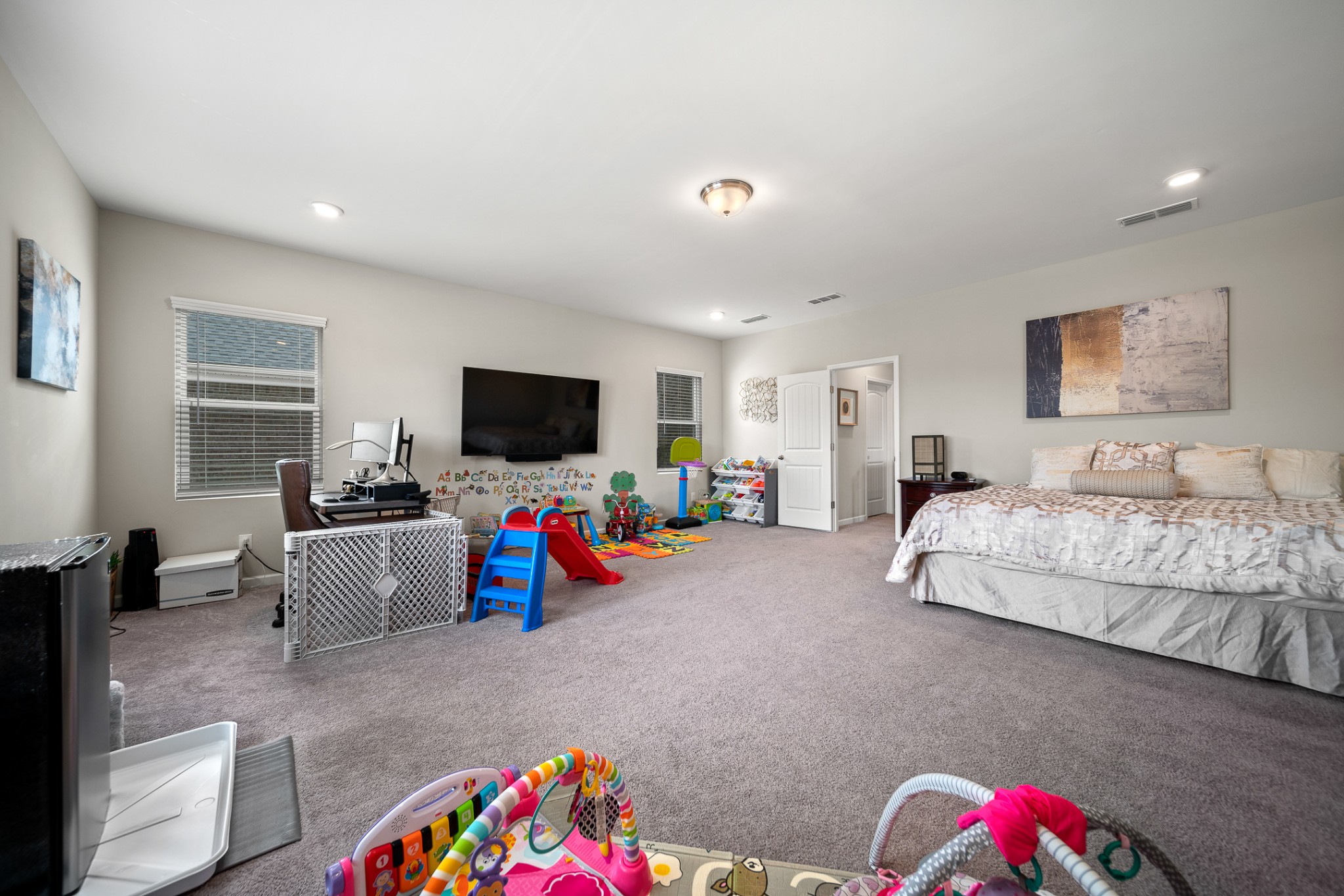 3725 Hoggett Ford Road Hermitage, TN 37076 - Photo 12 of 22 a bedroom with furniture and a flat screen tv