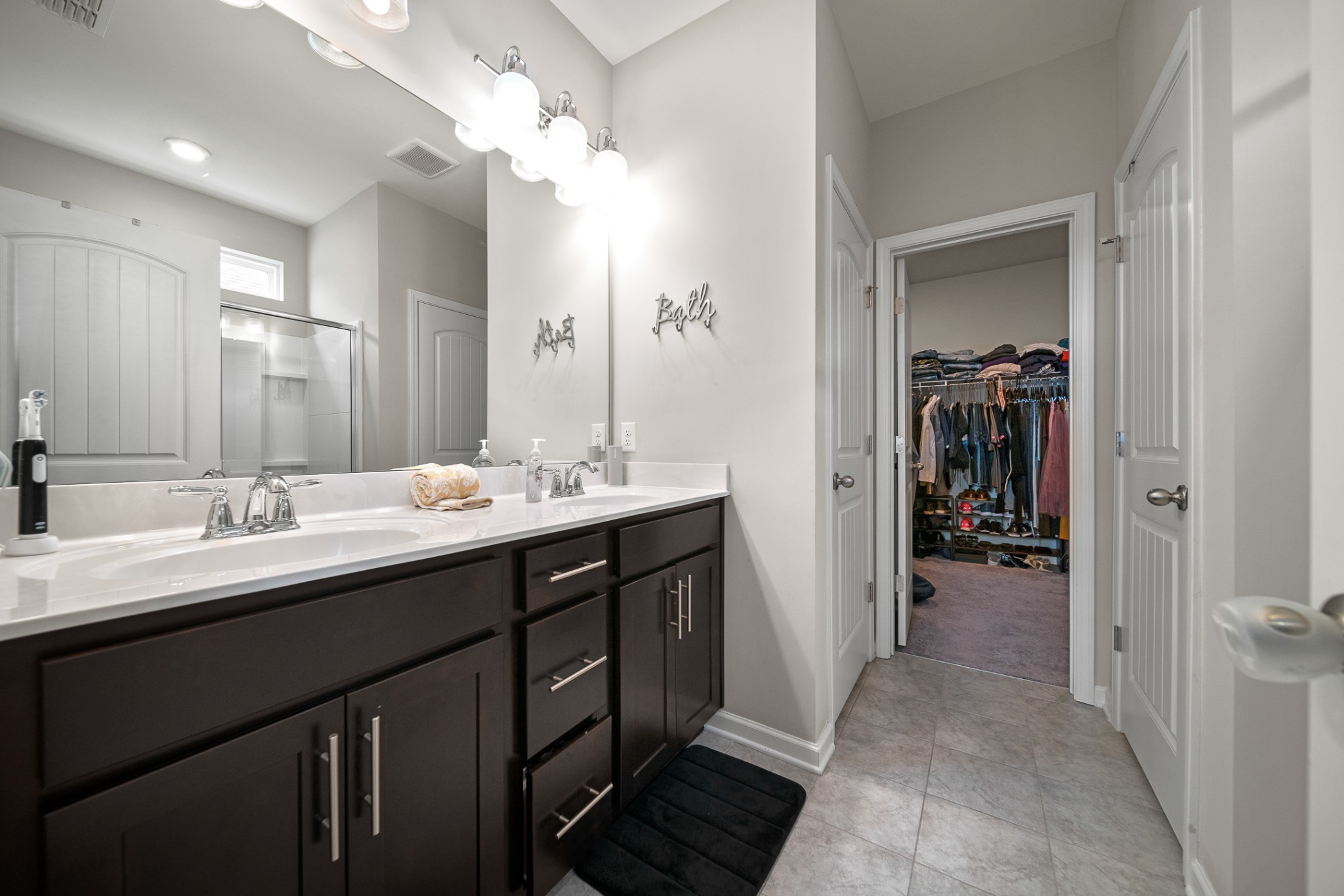 3725 Hoggett Ford Road Hermitage, TN 37076 - Photo 14 of 22 a bathroom with a double vanity sink and a mirror