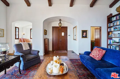 a living room with furniture and a rug