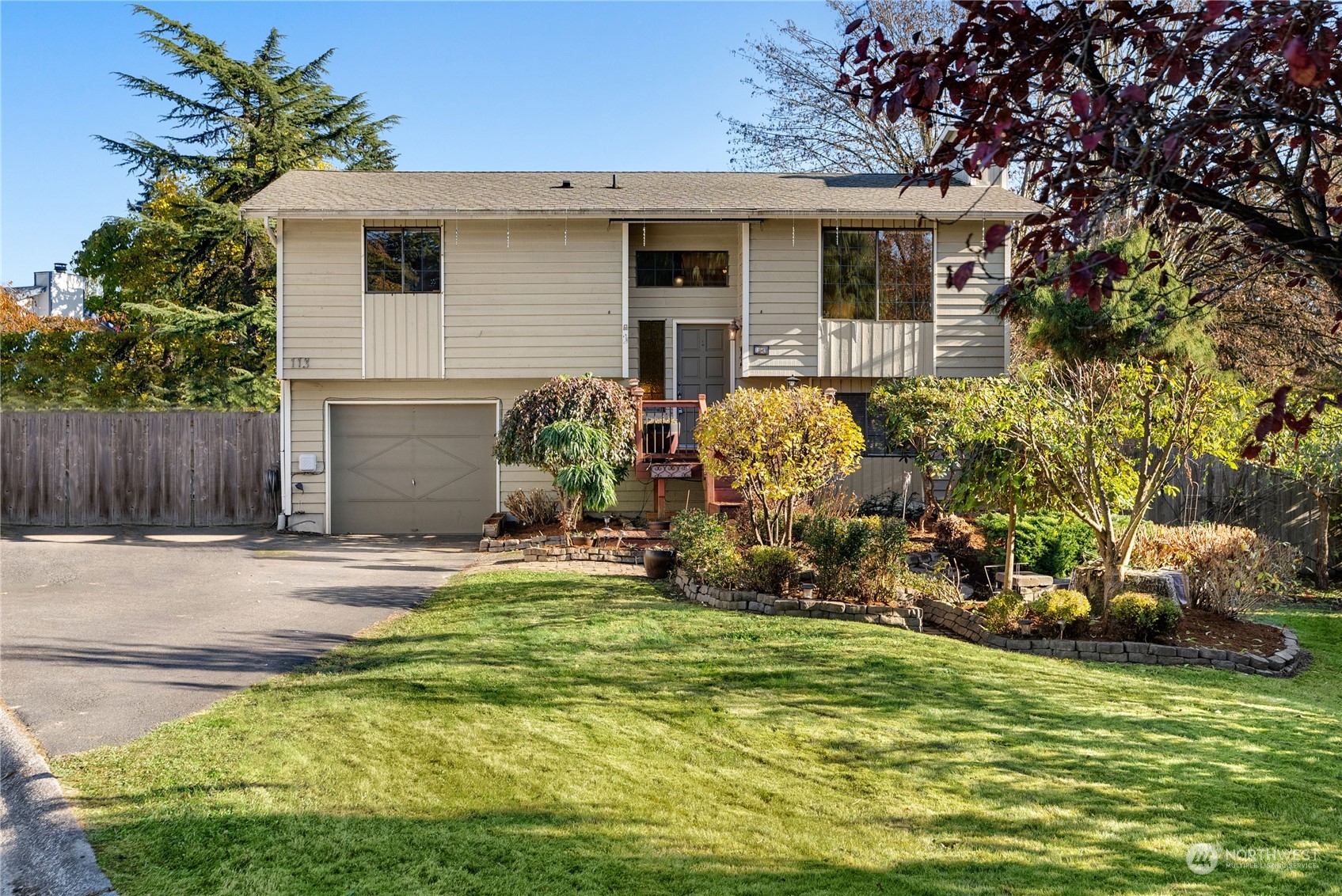 113 239th Place Southwest Bothell, WA 98021 - Photo 1 of 31 a front view of a house with a yard garage and outdoor seating