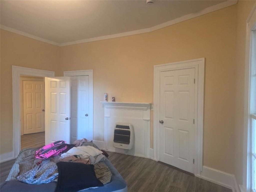 108 G Avenue Thomaston, GA 30286 - Photo 11 of 19 a bedroom with a bed and a fireplace