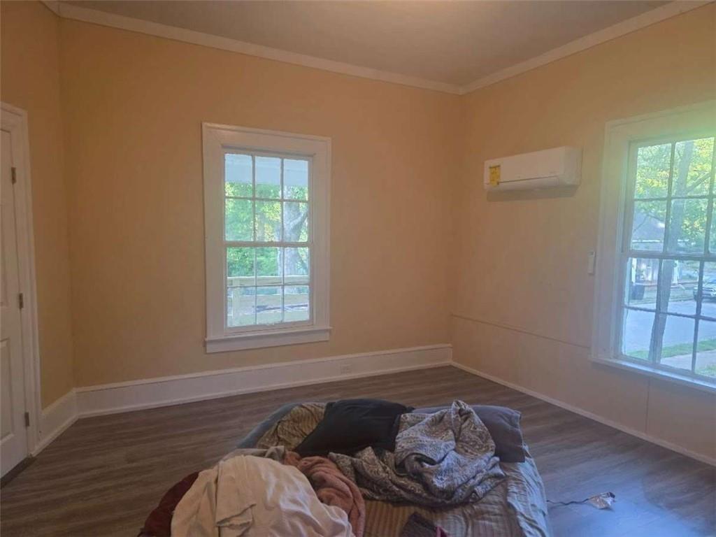 108 G Avenue Thomaston, GA 30286 - Photo 12 of 19 a bed sitting in a bedroom next to a window