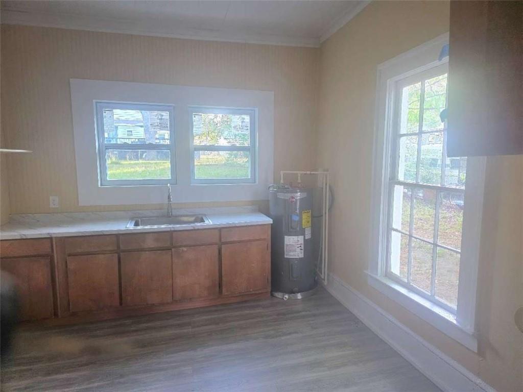 108 G Avenue Thomaston, GA 30286 - Photo 2 of 19 a view of a kitchen with a sink and a window