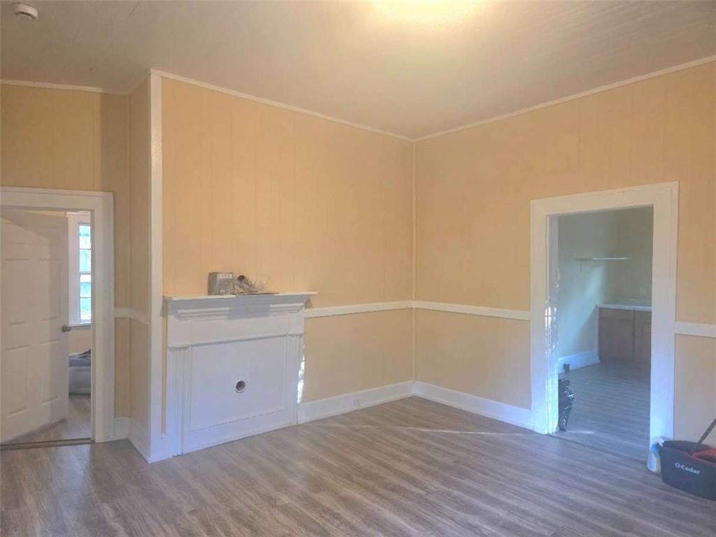 108 G Avenue Thomaston, GA 30286 - Photo 6 of 19 a view of kitchen and wooden floor
