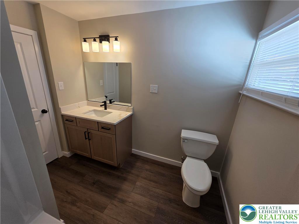 1958 Aripine Avenue Bethlehem, PA 18018 - Photo 19 of 30 a bathroom with a toilet sink and mirror