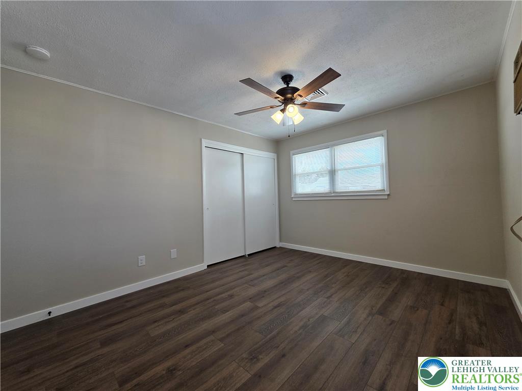 1958 Aripine Avenue Bethlehem, PA 18018 - Photo 24 of 30 an empty room with wooden floor and windows