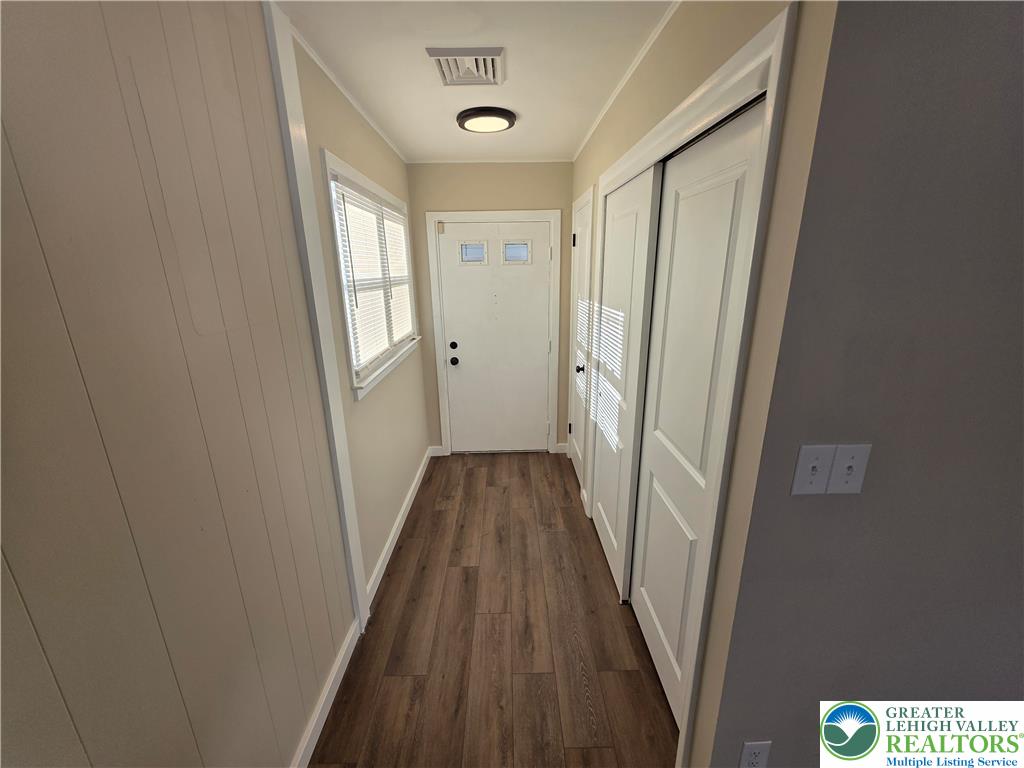 1958 Aripine Avenue Bethlehem, PA 18018 - Photo 6 of 30 a view of a hallway with wooden floor and staircase