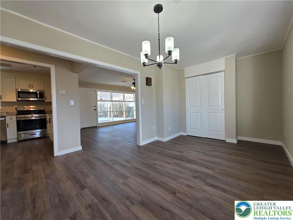 1958 Aripine Avenue Bethlehem, PA 18018 - Photo 10 of 30 a view of a livingroom with a chandelier wooden floor and windows