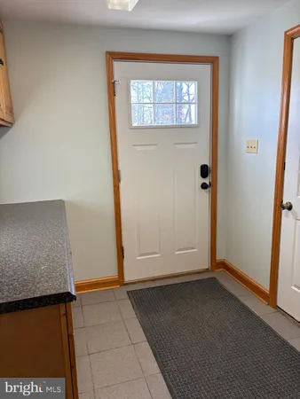 a kitchen with granite countertop granite countertop white cabinets and a sink