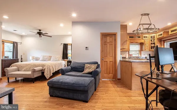 a spacious bedroom with two beds and a chandelier