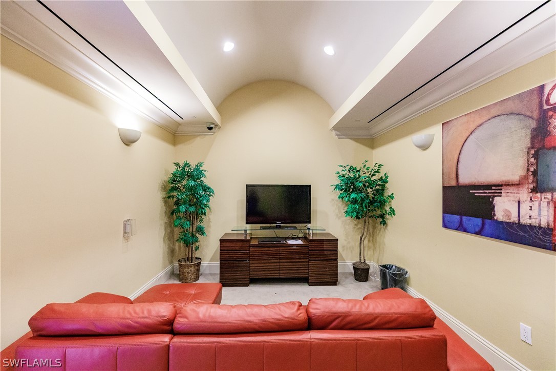 2743 First Street, Unit 704 Fort Myers, FL 33916 - Photo 16 of 17 a living room with furniture and a flat screen tv