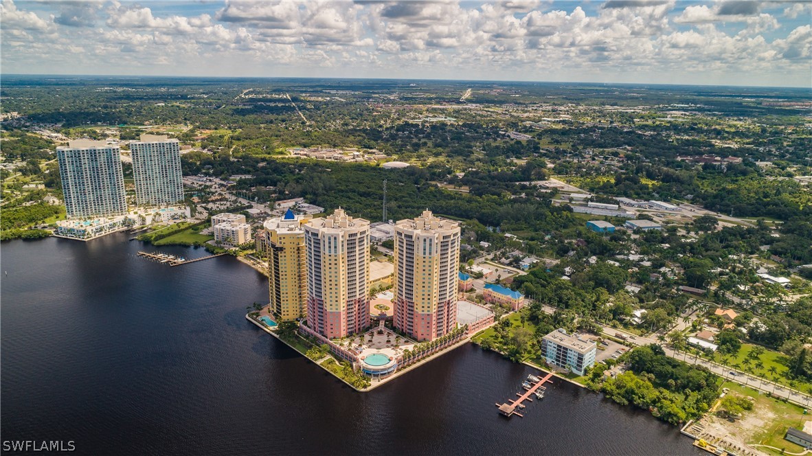 2743 First Street, Unit 704 Fort Myers, FL 33916 - Photo 17 of 17 an aerial view of residential houses with outdoor space and ocean view
