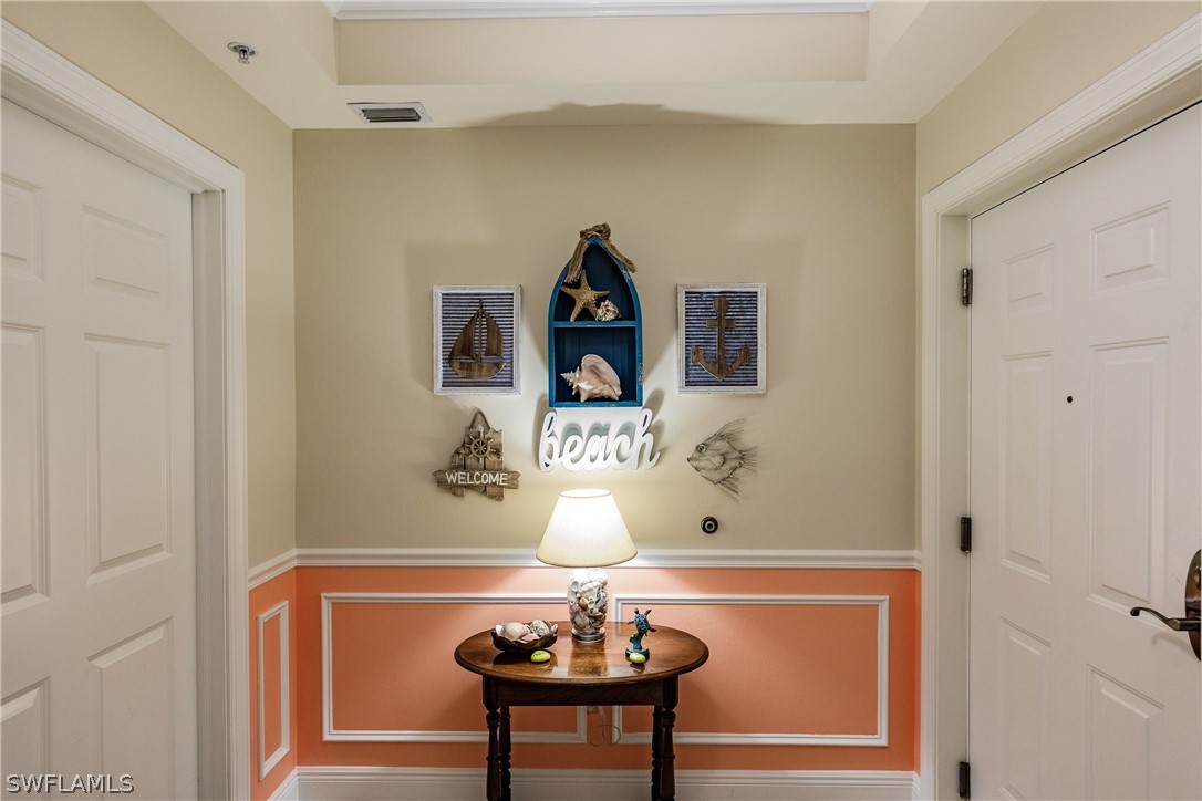 2743 First Street, Unit 704 Fort Myers, FL 33916 - Photo 4 of 17 a room with a table and a mirror