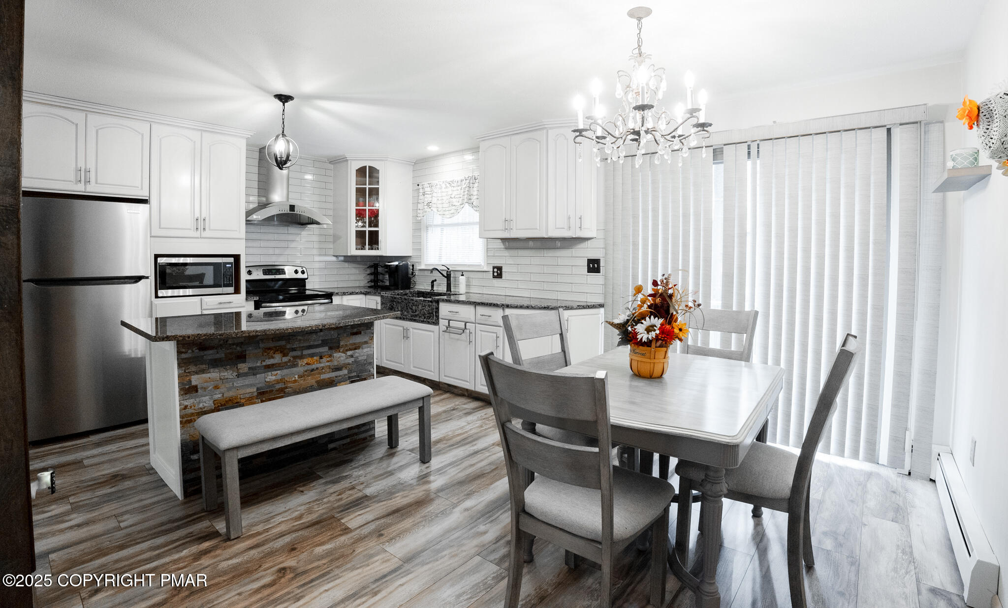 3118 Ogontz Drive Pocono Lake, PA 18347 - Photo 16 of 66 a kitchen with granite countertop a table chairs stove and refrigerator